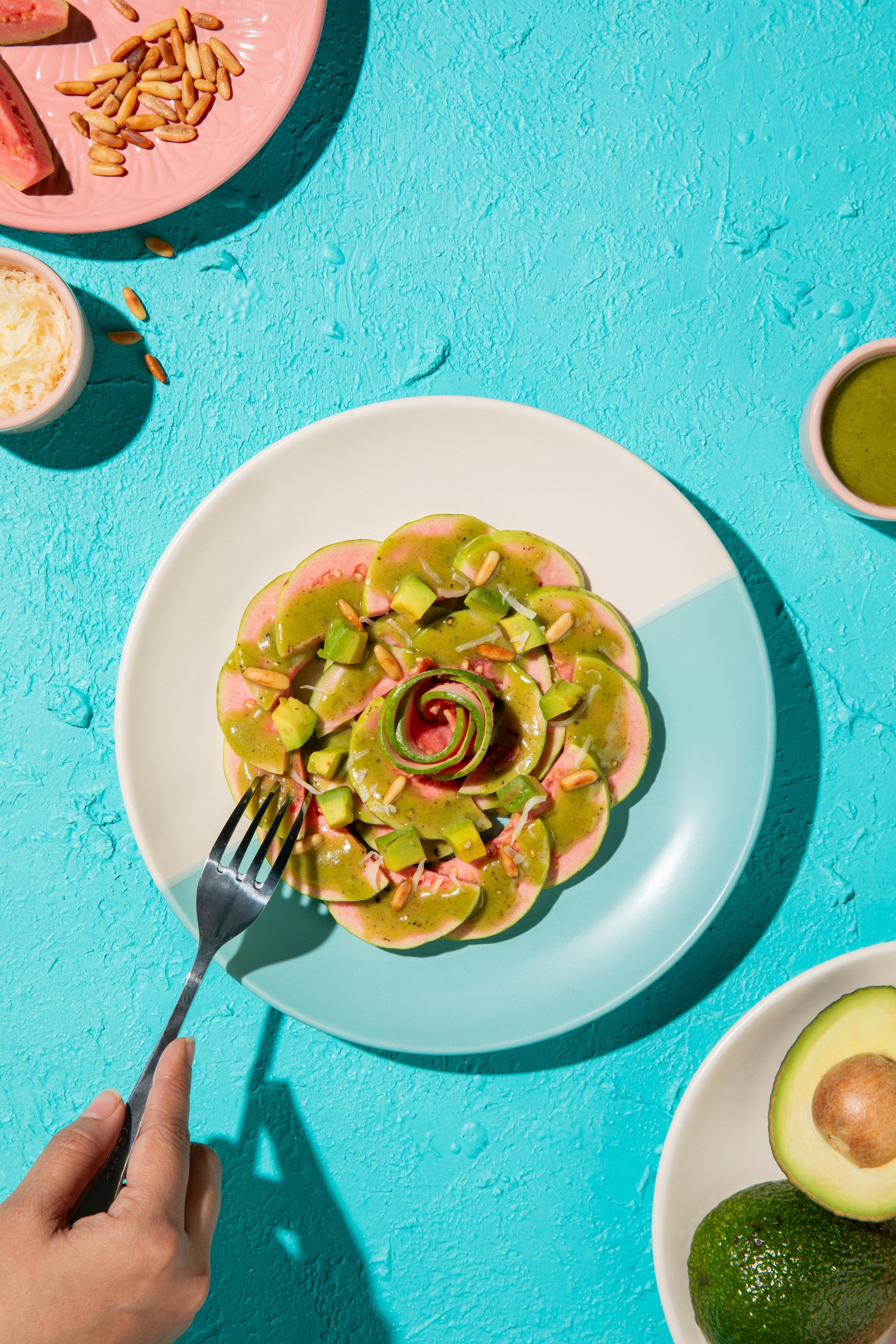 Guava carpaccio with avocado, pine nuts and a herb dressing